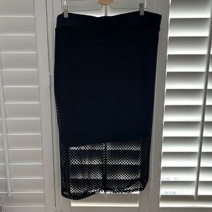 Black stretchy mid length pencil skirt with eyelet cutout overlay